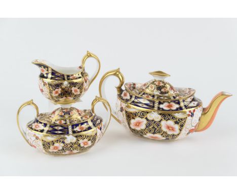 Royal Crown Derby three piece tea service, in traditional imari colours, pattern 2451, circa 1906/07, comprising lidded teapo