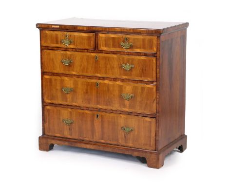 Walnut chest of drawers, 18th Century and later, the top with broad crossbanding, over two short and three long graduated dra