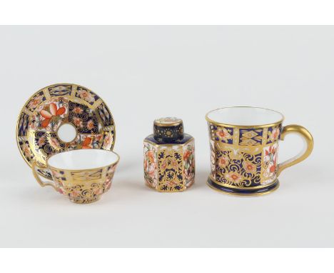 Royal Crown Derby miniature tea cup and saucer, circa 1912, pattern 2451, printed marks, height 3cm; also Royal Crown Derby m