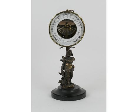 Brass cased holosteric barometer, supported on a base of brass cast as Don Quixote, polished slate plinth, height 32cm 