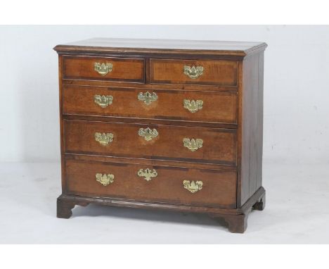 George III oak and mahogany chest of drawers, late 18th Century, having two short and three long drawers, with brass handles,