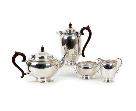 George V silver four piece tea service, by Adie Bros., Birmingham 1928/29, comprising teapot, hot water jug, sugar basin and 