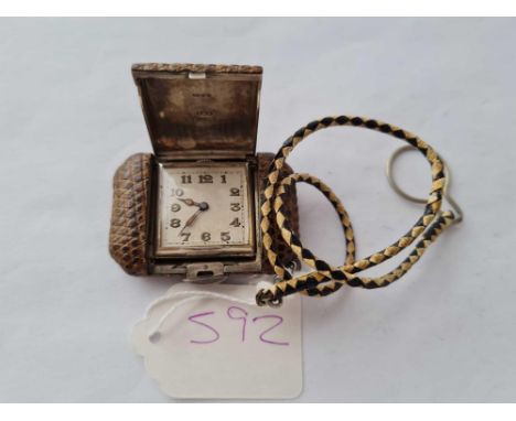 A art deco silver leather covered traveling watch with pop up case 