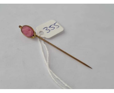 A Vintage coral stick pin.