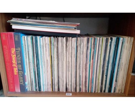 A shelf of numerous LP records