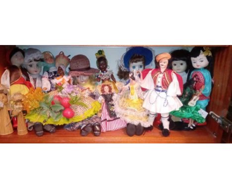 A shelf of oriental dolls