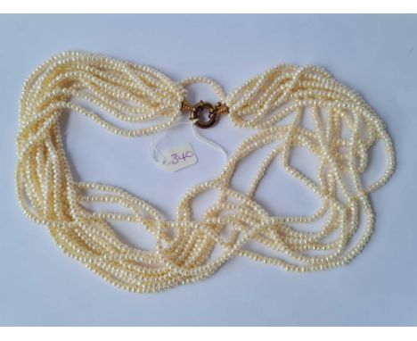 A ten strand pearl necklace with circular gilt clasp