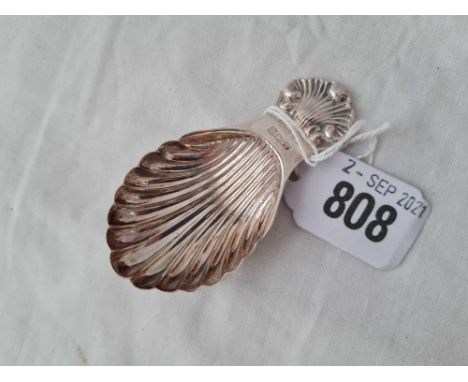 A caddy spoon with shell decoration - Birmingham 1973
