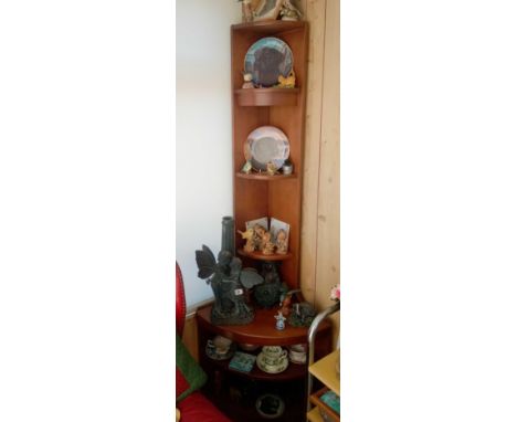 A corner bracket with model birds, hedgehog etc