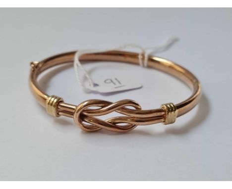 A vintage hinged 9ct rose gold knot bangle 12.6g