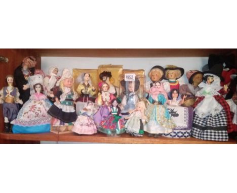 A shelf of continental costume dolls approx 30