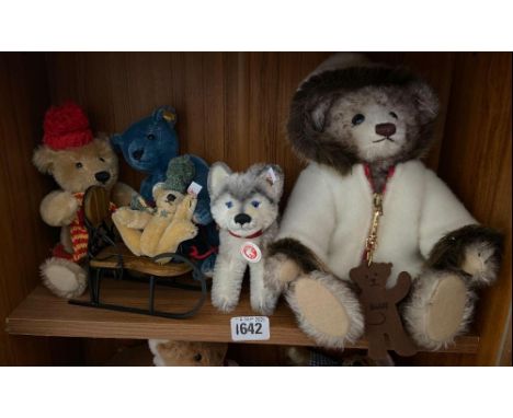 Five Steiff bears (on middle shelf)