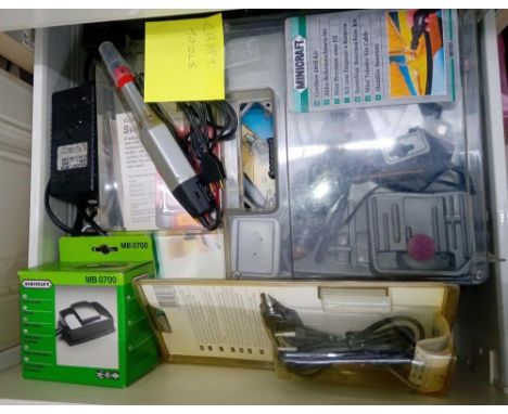 A drawer with unused Mini Craft tools, small vices etc