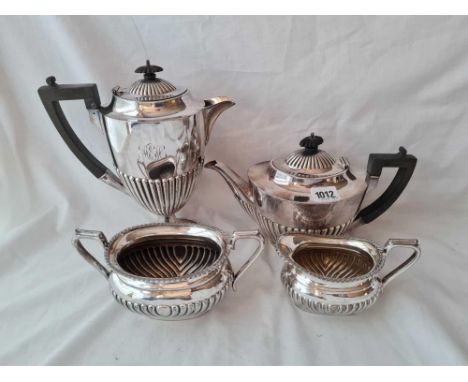 A oval half fluted coffee pot teapot and sugar and cream jug 