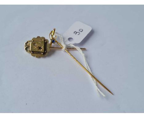 A Edwardian 9ct sapphire and pearl stick pin together with a Victorian sapphire and diamond stick pin - 2.4 gms 