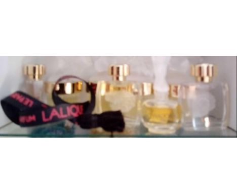  A shelf containing miniature french and other scent bottles