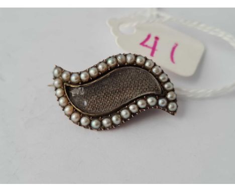 A antique gold pearl set brooch 