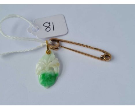 A pale green jade 14ct gold pendant and a 9ct pin (1.7g)