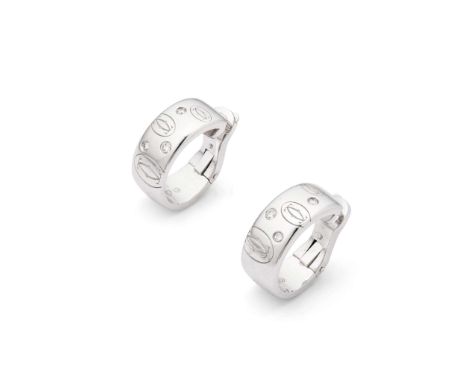  Cartier: A pair of 'Happy Birthday' diamond earrings circa 2010 Each polished hoop, engraved with the double C logo, gypsy-s