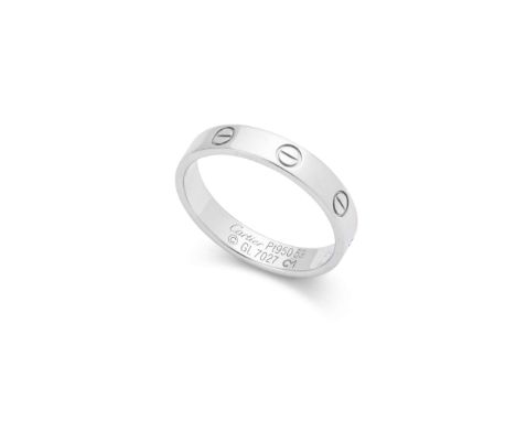  Cartier: A platinum "Love" ring  Small model; the thin platinum band decorated at intervals with screwhead motifs, signed Ca