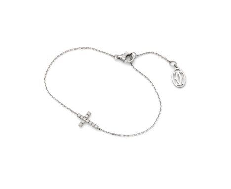  Cartier: A white gold and diamond 'Symbols' bracelet  The fine 18 carat white gold trace-link chain, horizontally featuring 