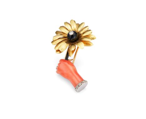  Cartier: A coral and diamond flower brooch circa 1940 The coral corallium rubrum hand, adorned with a rose-cut diamond cuff 