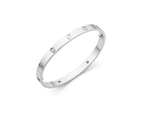  Cartier: A diamond 'Love' bangle  The polished bangle accented at intervals with alternating screwhead motif and brilliant-c