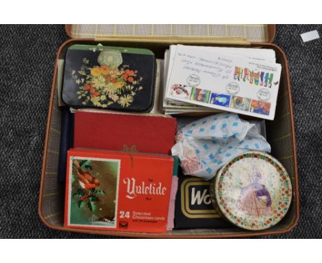 A suitcase of Stamps, UK &amp; World, On and off paper, loose and in albums along with First Day Covers mainly used