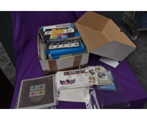 A collection of approx 230 GB Presentation Packs, 1976- 2002 along with similar period First Day Covers and unused Stamps, ap
