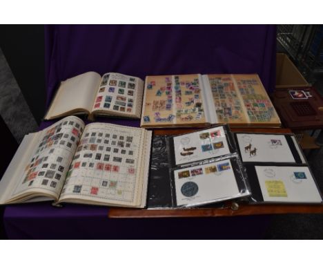 Three albums of Commonwealth and World Stamps, mint &amp; used, 20th century onwards along with an a album of Switzerland Fir