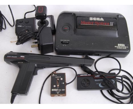 SEGA MASTER SYSTEM: An original SEGA master system game console, with control stick, control pad, light phaser, power supply,