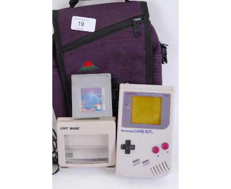 GAME BOY: An original Nintendo Game Boy with carry case, Light Magic accessory, Tetris game cartridge, etc.

All items came f