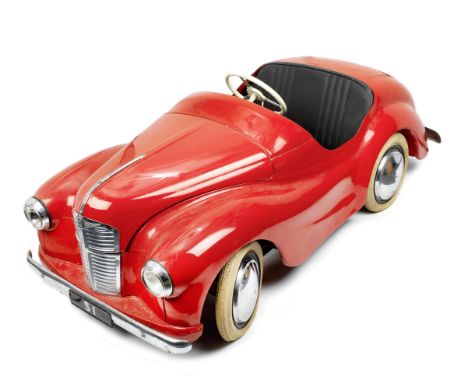 An Austin J40 child's pedal car, British, 1960s,chassis number indistinct, finished in red with black upholstery, chromed bri