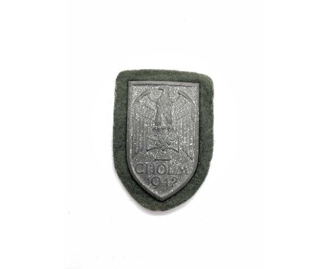 WWI Third Reich German Army Cholm/Kholm 1942 Campaign Shield, with field grey cloth backing.Due to the nature of these items 
