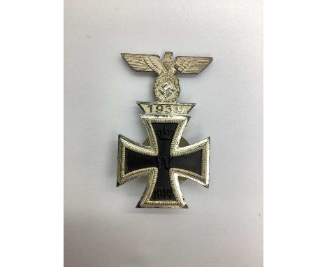 WWII Third Reich German 1914 First Class Iron Cross, with factory applied 1939 clasp, maker marks on reverse L/18.Due to the 