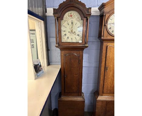 Fuller, Watton, a Georgian long case clock with painted arch dial to a brass eight day movement, set in an oak case with pill