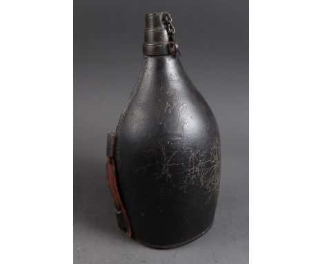A 17th century leather flask/bottle, 11" high (comparable example in Horniman Museum NN14528)