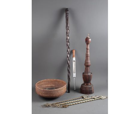 A turned hardwood table lamp, 21 1/2" high, a similar walking cane, a woven and mother-of-pearl inlaid bowl, a set of fire ir