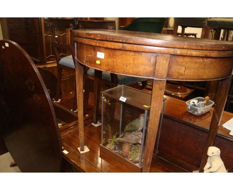 A late 19th century mahogany semi-circular fold-over top card table, on square taper supports, 36" wide x 17 1/2" deep x 29" 