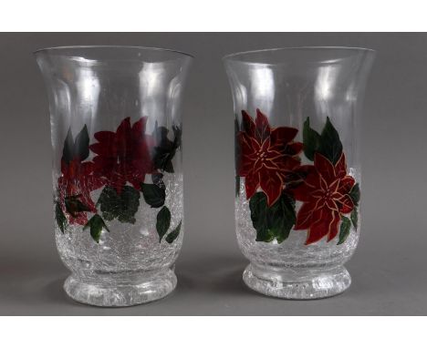 A pair of poinsettia enamelled storm lamp/candlesticks, 8" high