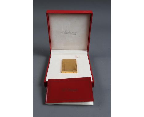 An ST Dupont gilt cased Gatsby lighter, in original case, boxed