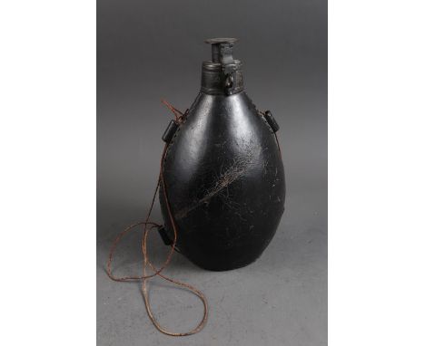 A 17th century leather flask/bottle, 11" high (comparable example in Horniman Museum NN14528)