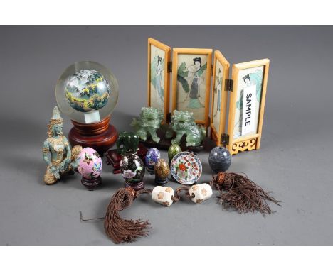 A Chinese interior painted paperweight with matched stand, a quantity of enamelled and polychrome decorated eggs, a carved ja