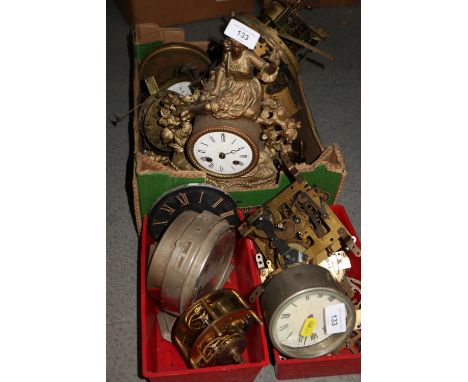 A gilt metal mantel clock with woman finial and enamelled dial, and various mantel clock movements