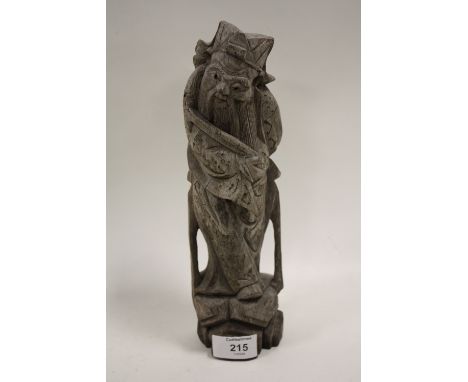 A VINTAGE ORIENTAL STYLE CARVED WOODEN FIGURE 