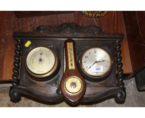 AN OAK BARLEY TWIST COMBINATION CLOCK BAROMETER TOGETHER WITH ANOTHER