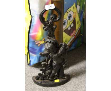 A VINTAGE CAST IRON DOORSTOP