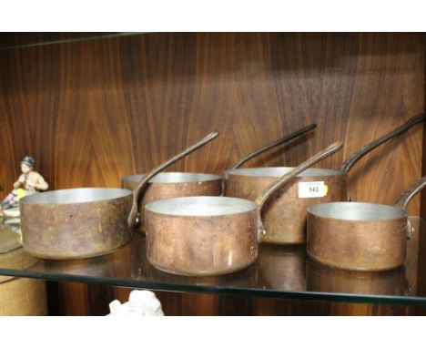 A SET OF FIVE VINTAGE GRADUATED SAUCEPANS 