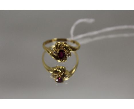 AN 18 CARAT YELLOW GOLD RUBY AND DIAMOND RING, the ruby being an estimated 0.30 carat, ring size O