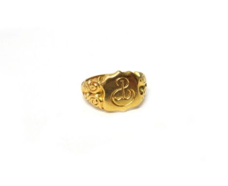 An 18ct gold shield shaped signet ring, monogram engraved, Birmingham 1911, ring size R, weight 13.5 gms.